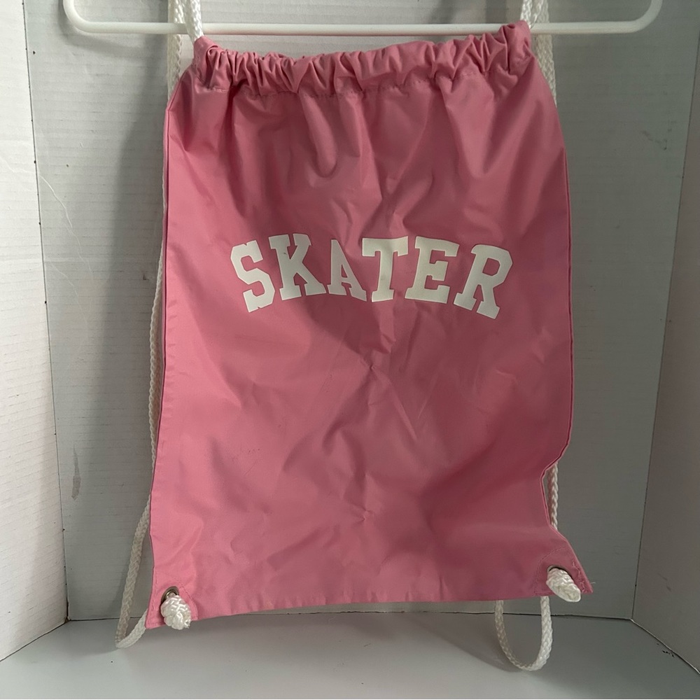 Pink nylon drawstring cinch bag/backpack with SKATER logo